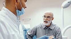 elderly man at a dental implant consultation