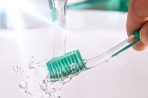 Rinsing toothbrush, applying advice from dentist in State College